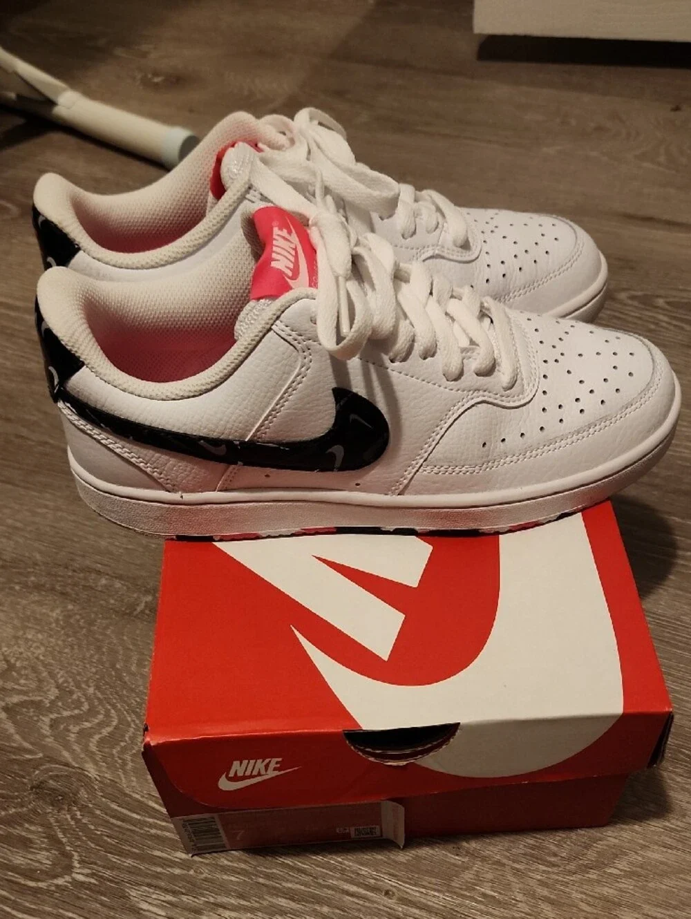 Nike Womens White Low-Top Sneakers with Black Swoosh and Pink Lining
